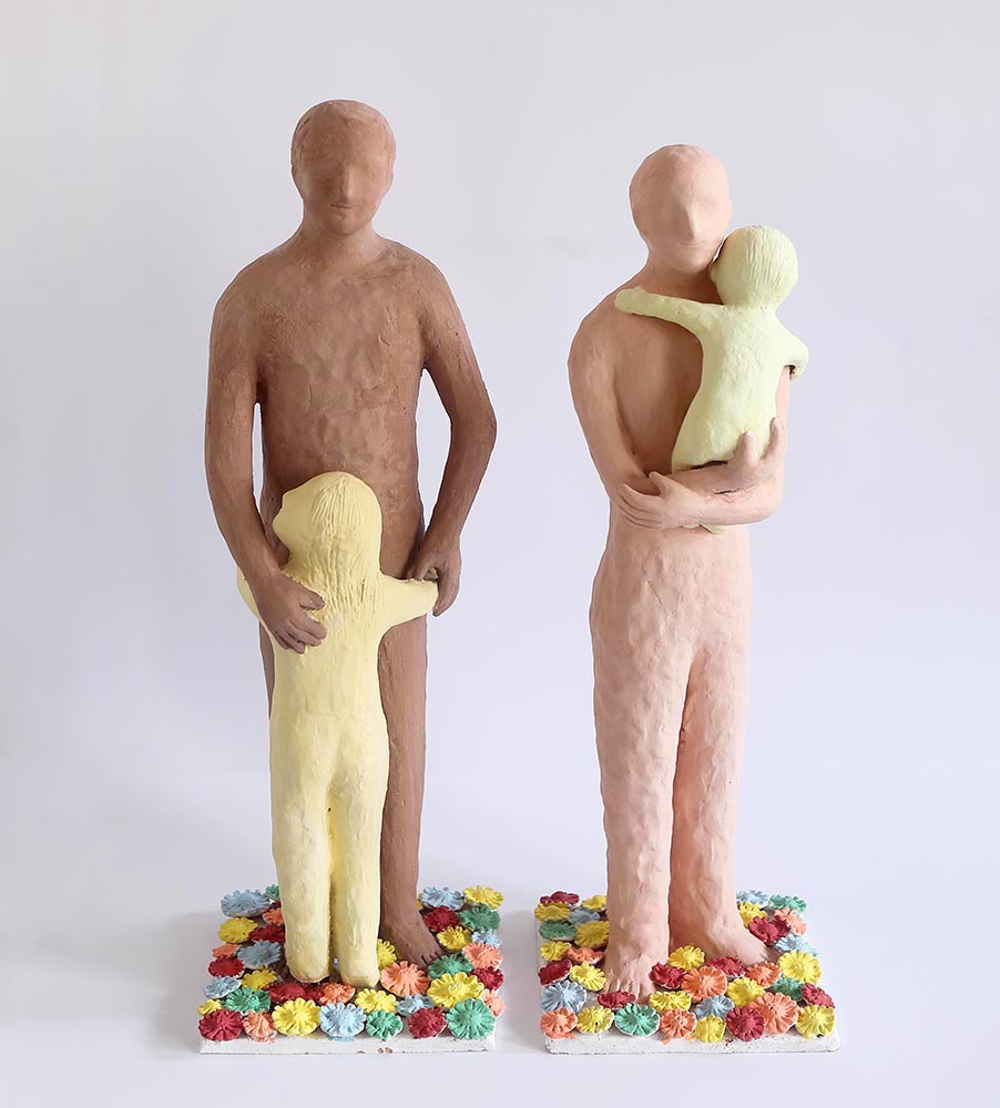 Family 2014, Sculpture by Kazumasa Mizokami, It consists of two statues, they are of a father with a daughter, the other is a mother with a child. the colors of the statues are light brown, the small ones applied like the lemon pastel color.
