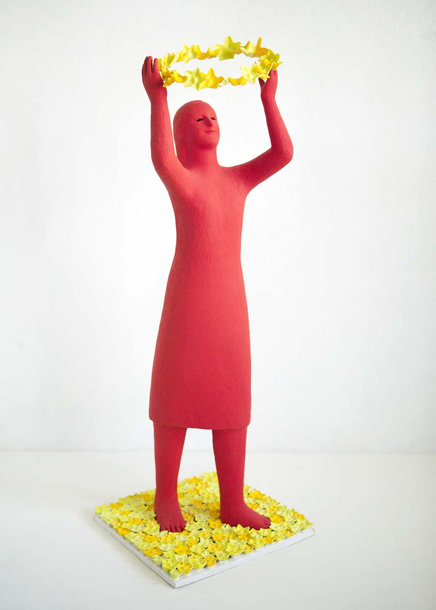 Girl playing with flower 2003, Sculpture by Kazumasa Mizokami, A red girl statue raises a circle of yellow flowers with both hands and there are many yellow flowers underneath her.
