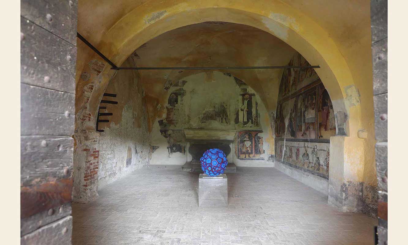Shot of exhibited 2019 title beat-of-thought, a blue sphere by Kazumasa Mizokami in an ancient fresco of Capera di San Rocco 
