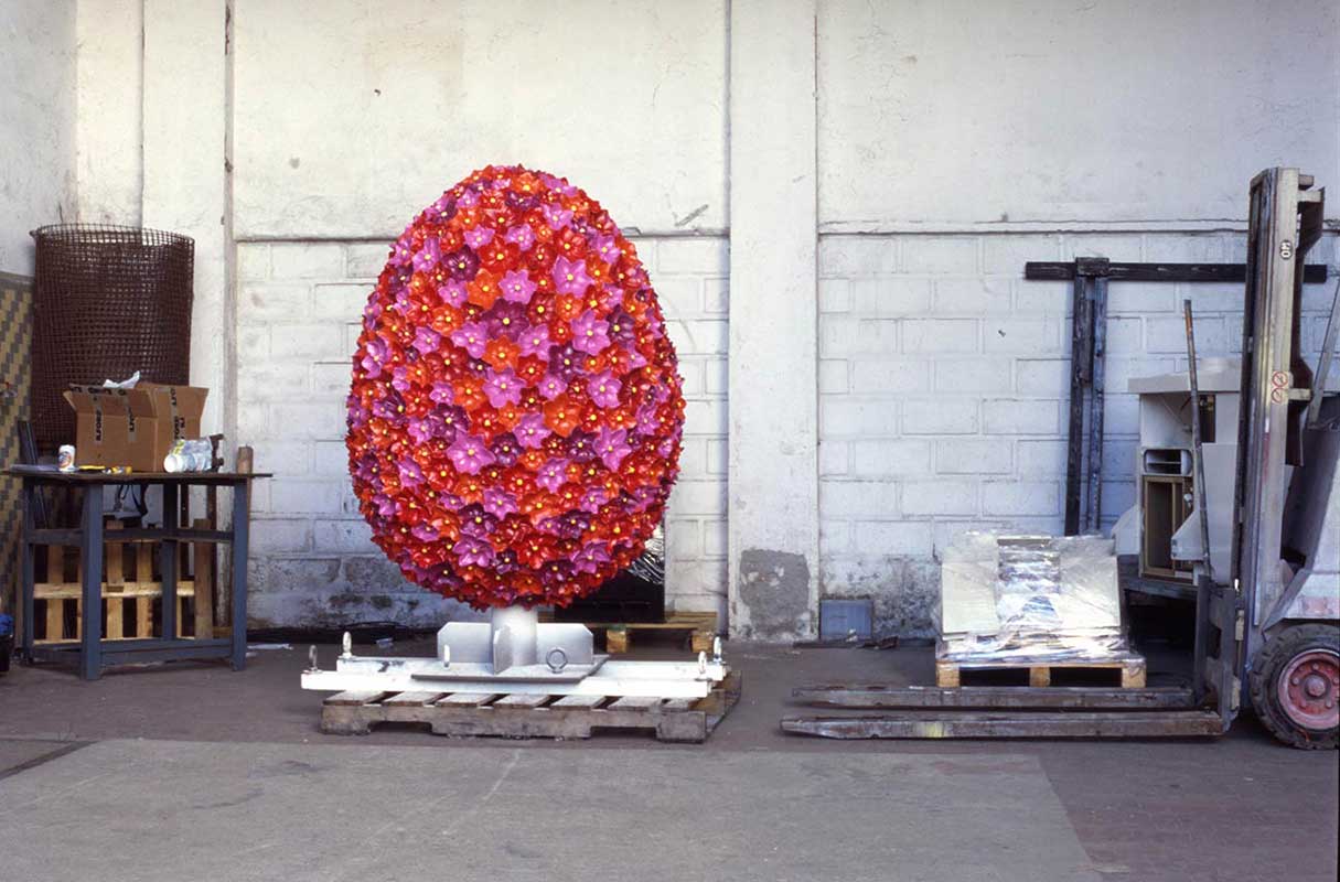 The sculpture by Kazumasa Mizokami, title is Hope, above in the shape of an egg covered with red flowers, done in bronze was installed at the Asahi Ward Cultural Center in Osaka in 2000.